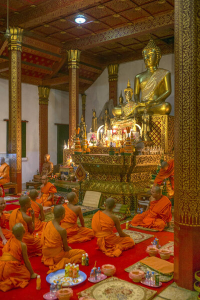 Monks in Wat Nong Sikhounmuang temple, Luang Prabang, Laos