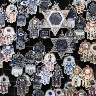 Religious objects for sale at market stall, Carmel Market, Tel Aviv, Israel clipart