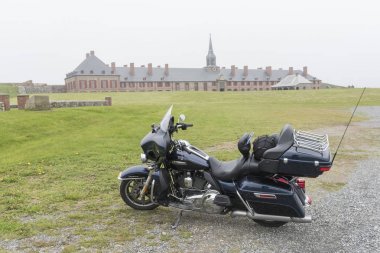 Motorcycle at Fortress of Louisbourg, Louisbourg, Cape Breton Island, Nova Scotia, Canada clipart