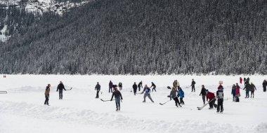 People playing ice hockey, Lake Louise, Banff National Park, Alberta, Canada clipart