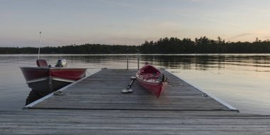 Kayak on a boardwalk, Lake of The Woods, Ontario, Canada clipart