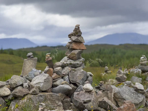 Stack of rocks on landscape, Scottish Highlands, Scotland