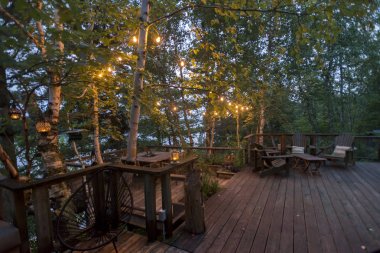 Wooden Deck with seating area, Kenora, Lake of The Woods, Ontario, Canada clipart