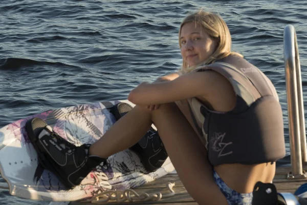 Young Girl Sitting Pier Looking Camera — Foto de Stock