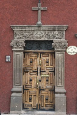 Wooden carved entrance door, Guadalupe, San Miguel de Allende, Guanajuato, Mexico clipart
