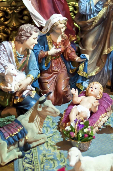 Christmas scene with figures of Jesus, Mary and Magus
