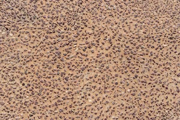 Красивая текстура пути серых гладких камней на оранжевом фоне находится в парке — стоковое фото