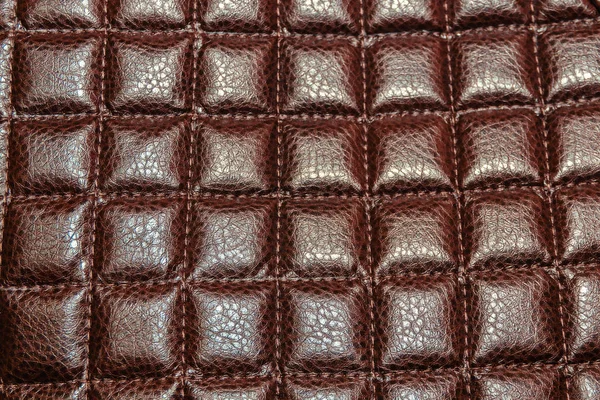 Background from brown leather upholstered furniture, stitched rhombus. — Stock Photo, Image