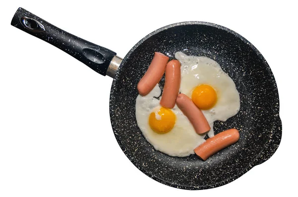 Frukost, stekta ägg i en kastrull med korv — Stockfoto