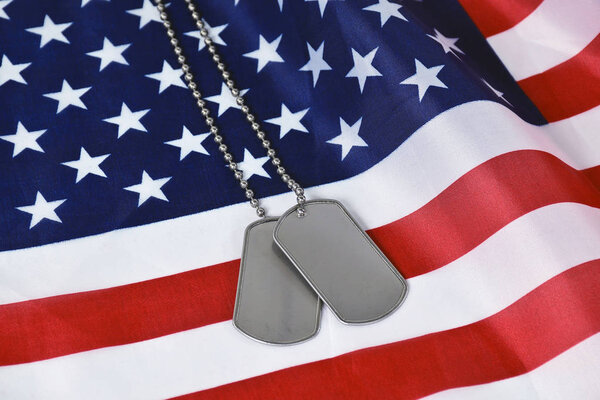 military dog tags on flag