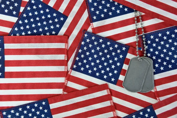 military dog tags on flag collage