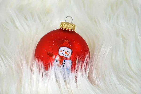 Ornamento de Natal boneco de neve na pele — Fotografia de Stock