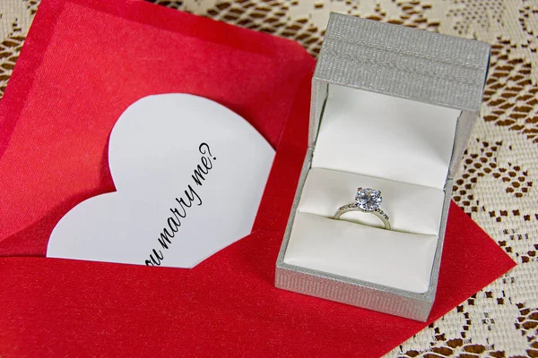 Marriage proposal on white heart with ring — Stock Photo, Image