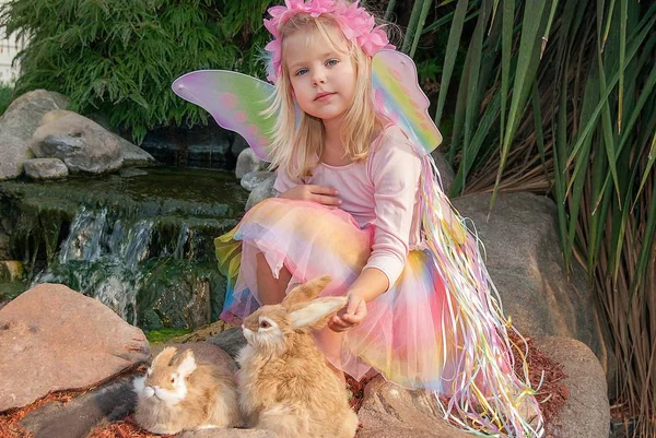 Little fairy girl with rabbits — Stock Photo, Image