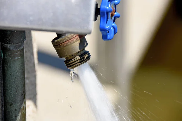 Water flowing out of faucet — Stock Photo, Image