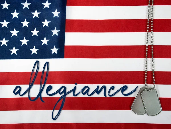 Word allegiance and dog tags on flag — Stock Photo, Image