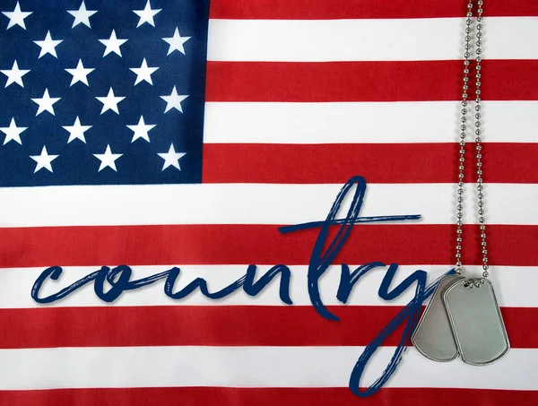 Word country and dog tags on flag — Stock Photo, Image