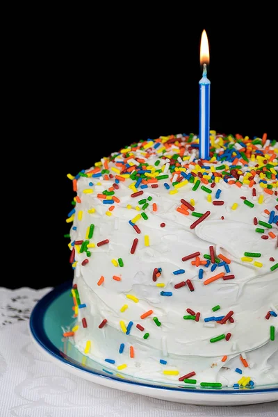 Geburtstagskerze auf Kuchen — Stockfoto