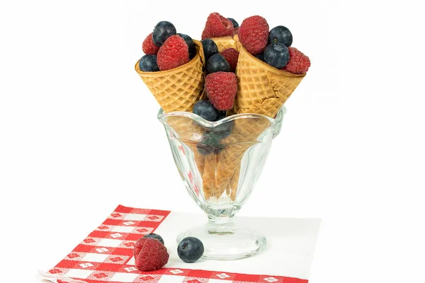 Blueberry and raspberry fruit in cones — Stock Photo, Image