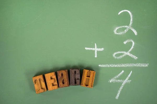 Math problems on green chalkboard — Stock Photo, Image