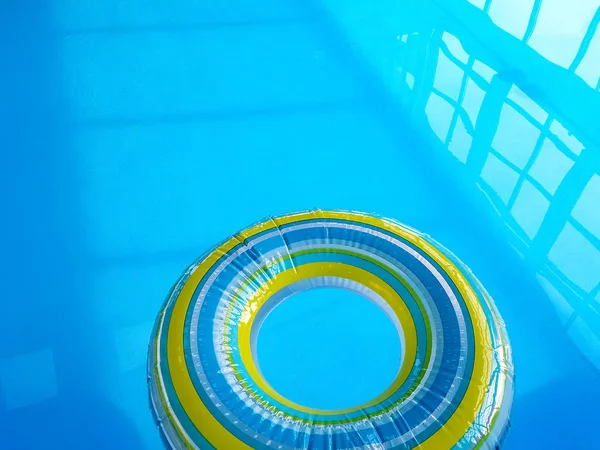 Striped in inflatable pool toy ring — Stock Photo, Image