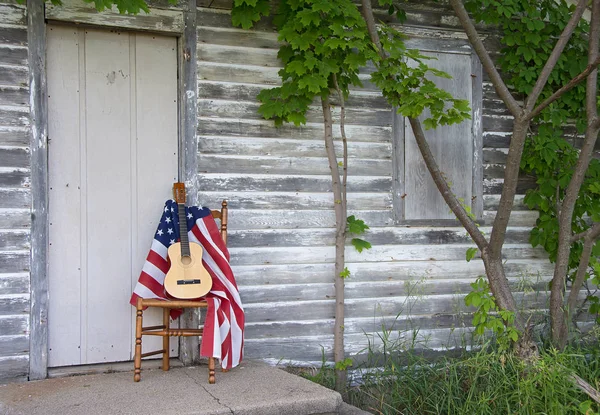American flag and guitar on wooden chair — Stock Photo, Image