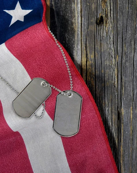 military dog tags on American flag