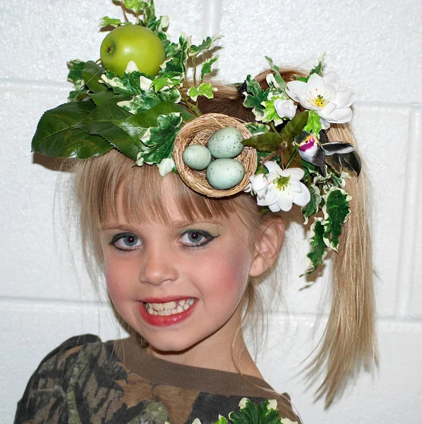 Smiling Young Caucasian Girl Wearing Floral Fruit Hat Bird Nest — Stock Photo, Image