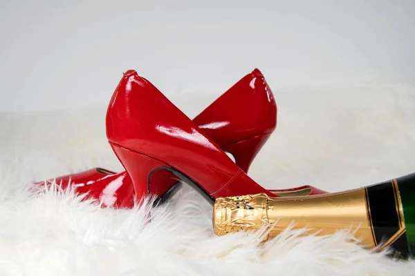 Pair Red High Heels White Fur Rug Champagne Bottle — Stock Photo, Image