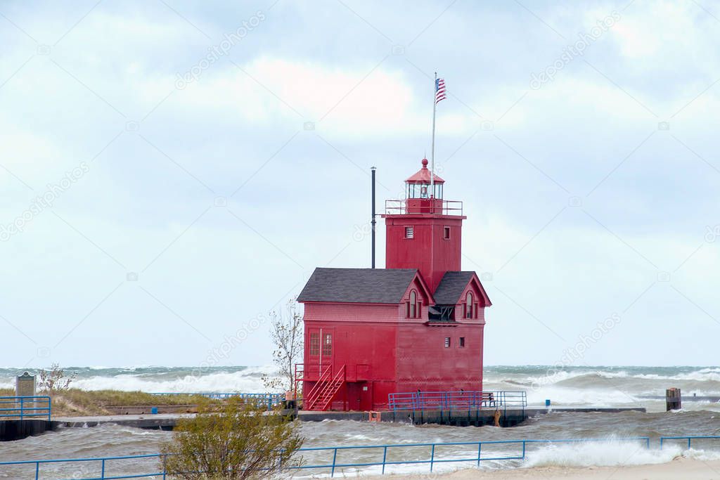 Holland Michigan Big Red lighthouse with high water level and waves
