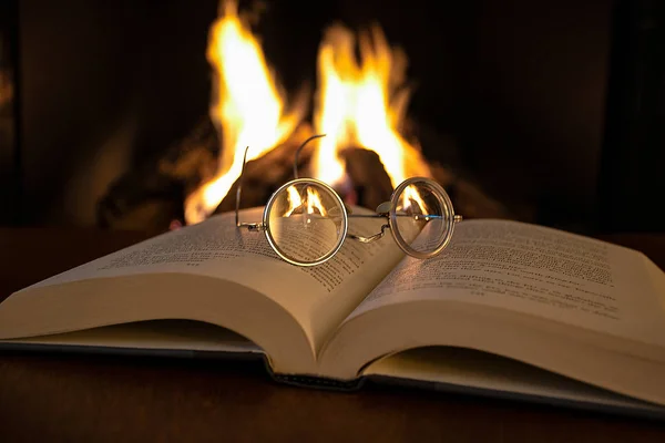 Close Vintage Eyeglasses Open Book Fireplace Background — Stock Photo, Image