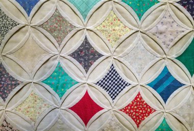 close up of cathedral window quilt pattern