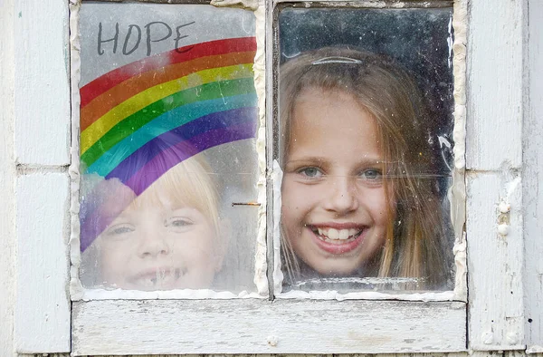 Two Young Girls Grungy Window Rainbow Sign Hope — Stock Photo, Image