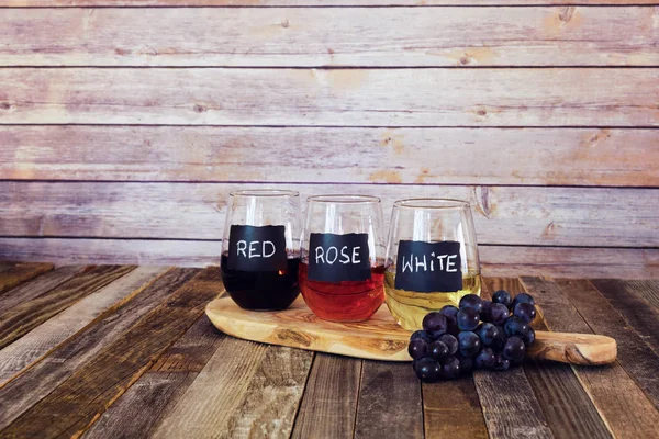 Three color wine flight in label glasses — Stock Photo, Image