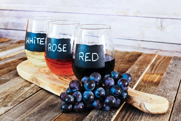 Three color wine flight in label glasses close up — Stock Photo, Image