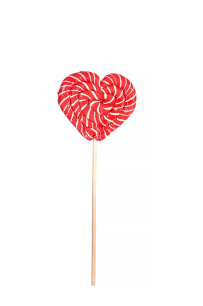 Piruleta roja en un palo en forma de corazón aislado en blanco — Foto de Stock