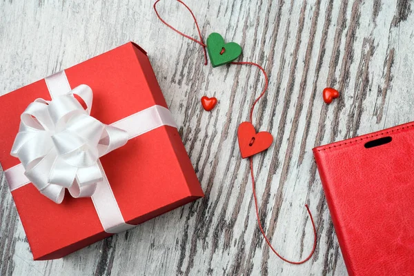 Valentines day red gift box on wooden board — Stock Photo, Image