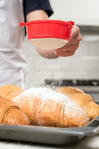 Powdered sugar on croissant — Stock Photo, Image