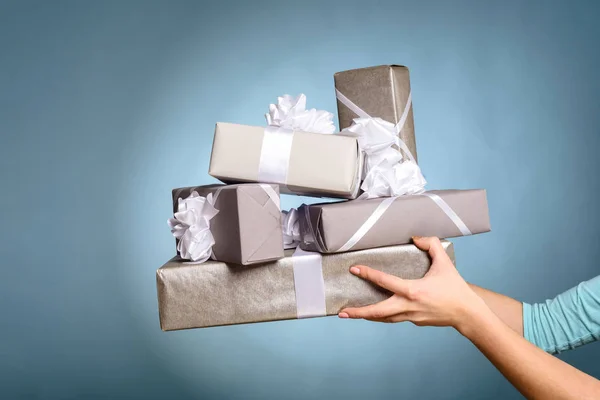 Hands holding gift box with as a present for Christmas — Stock Photo, Image