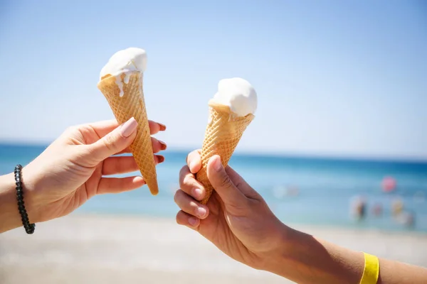 Two hand with ice cream horns — Stock Photo, Image