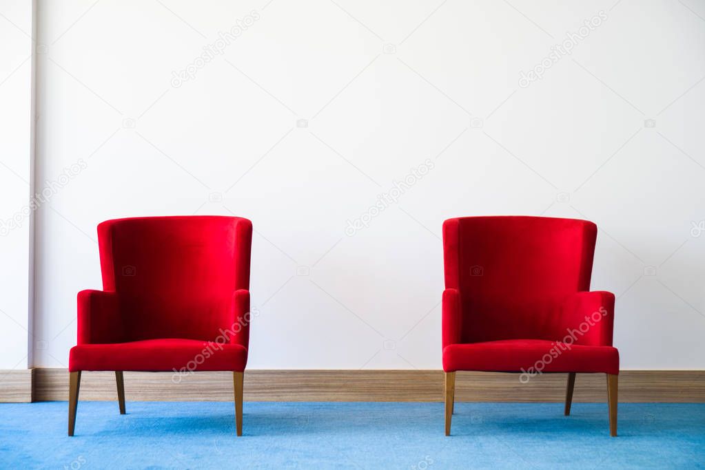 Red chair in white interior