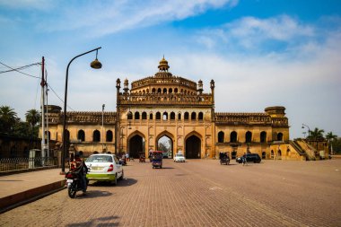 LUCKNOW, INDIA - DEC 19: Tourist and citizens near the famous historical gateway Rumi Darwaza at the sunny day on December 13,2019 in Lucknow, India clipart