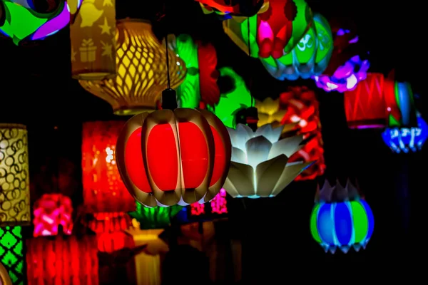 different colored paper chinese electric night lamp hanging from the ceiling on the occasion of chinese lunar new year.
