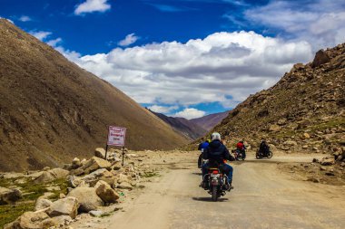 Ladakh,India. June 2016 - Gang of bike riders riding across rocky highway of ladakh, Kashmir, India