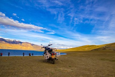 June 2016, Tsomoriri, Leh, India. A royal enfield motorbike along with tourist on the bank of lake Tsomoriri in the evening, Leh,India