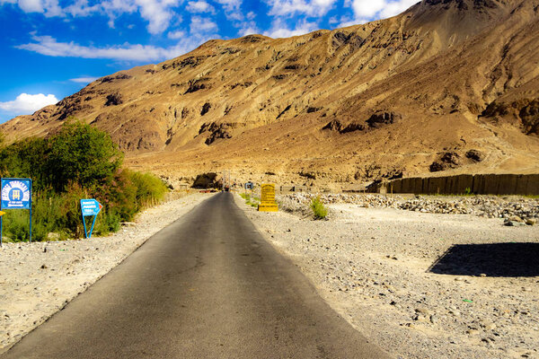 hilly highway in between barren himalayan mountains of leh ladakh, jammu and kashmir, India