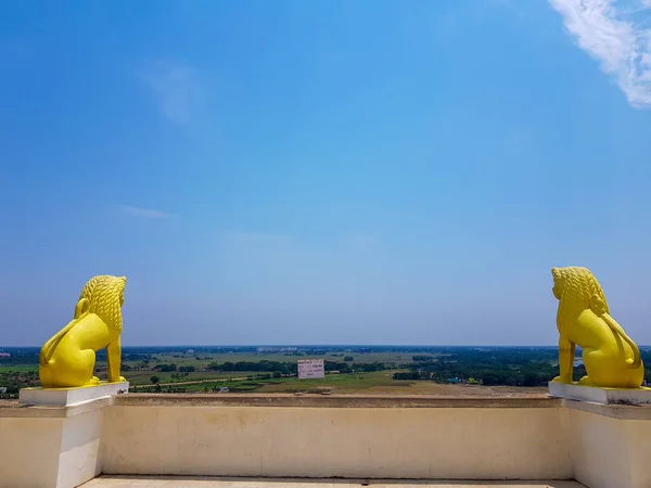 skyline of odisa and golden lion statues at theview point of dhauli shanti stupa at odisha,India