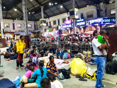 April 15. Howrah Station, West Bengal, India. Travelers stranded and crowding at Howrah station as trains get canceled due to covid19 lockdown. clipart