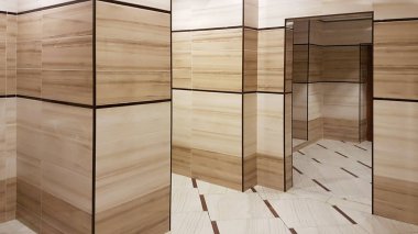 Açık bej ve beyaz renkleri banyo iç. Oval seramik klozet. Gerek erkekler için yer. Tuvalet ortak alanlarda kentsel altyapı. Kamusal alanlarda iç