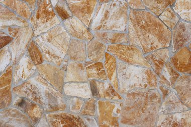 Antik Ortaçağ taş duvar. Doku duvar eski bir yapısının bir parçası. Tasarım ve yaratıcı çalışma için bir arka plan. Bina dış cephe süsleme ve dekorasyon. İnşaat işleri.